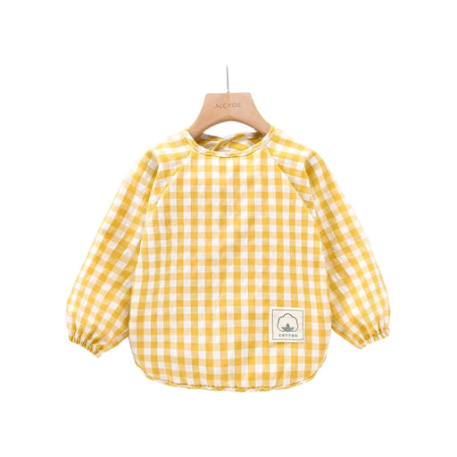a yellow and white checkered shirt hanging on a wooden hanger