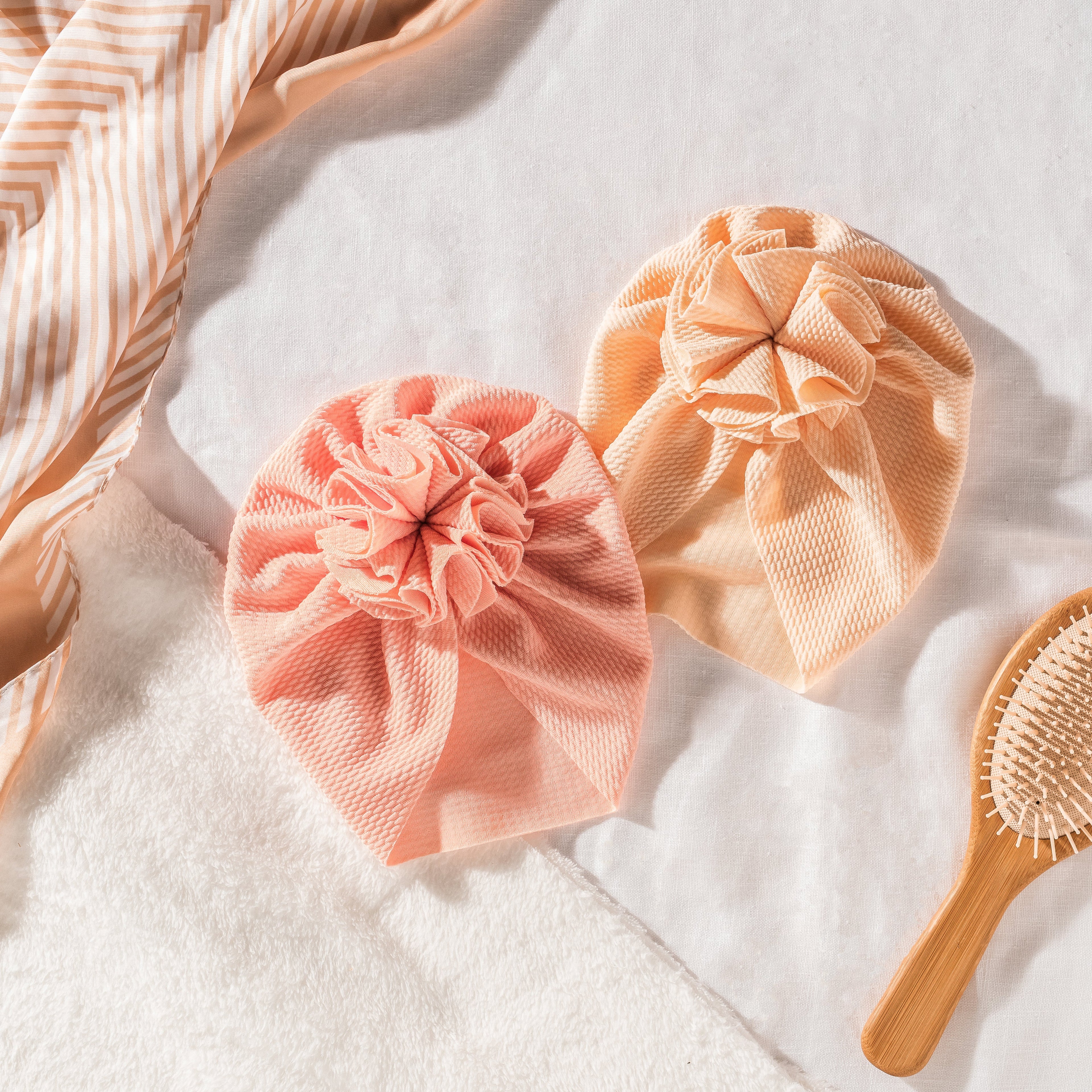 The History of the Baby Turban (And Why They're Having a Moment)