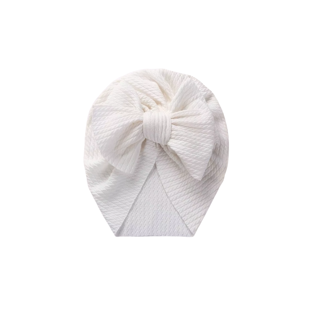 Snow white textured baby turban with bow detail — Billie Bow Turban on white background