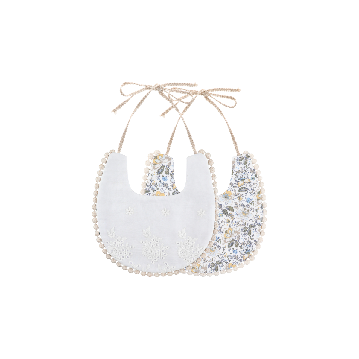 2 piece Clementine pom pom baby dribble bibs in sage floral: white broderie bib and sage leaf and blossom print bib