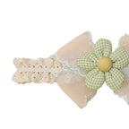 Cushion Daisy Crochet Baby Headband in Mint — cat baby headband showing face and soft texture