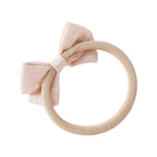 Dotty Embroidered Cotton Baby Bow in Blush — close-up of embroidered on blush baby accessory