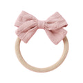 Blush cotton embroidered baby accessory — Dotty Embroidered Cotton Baby Bow on white background