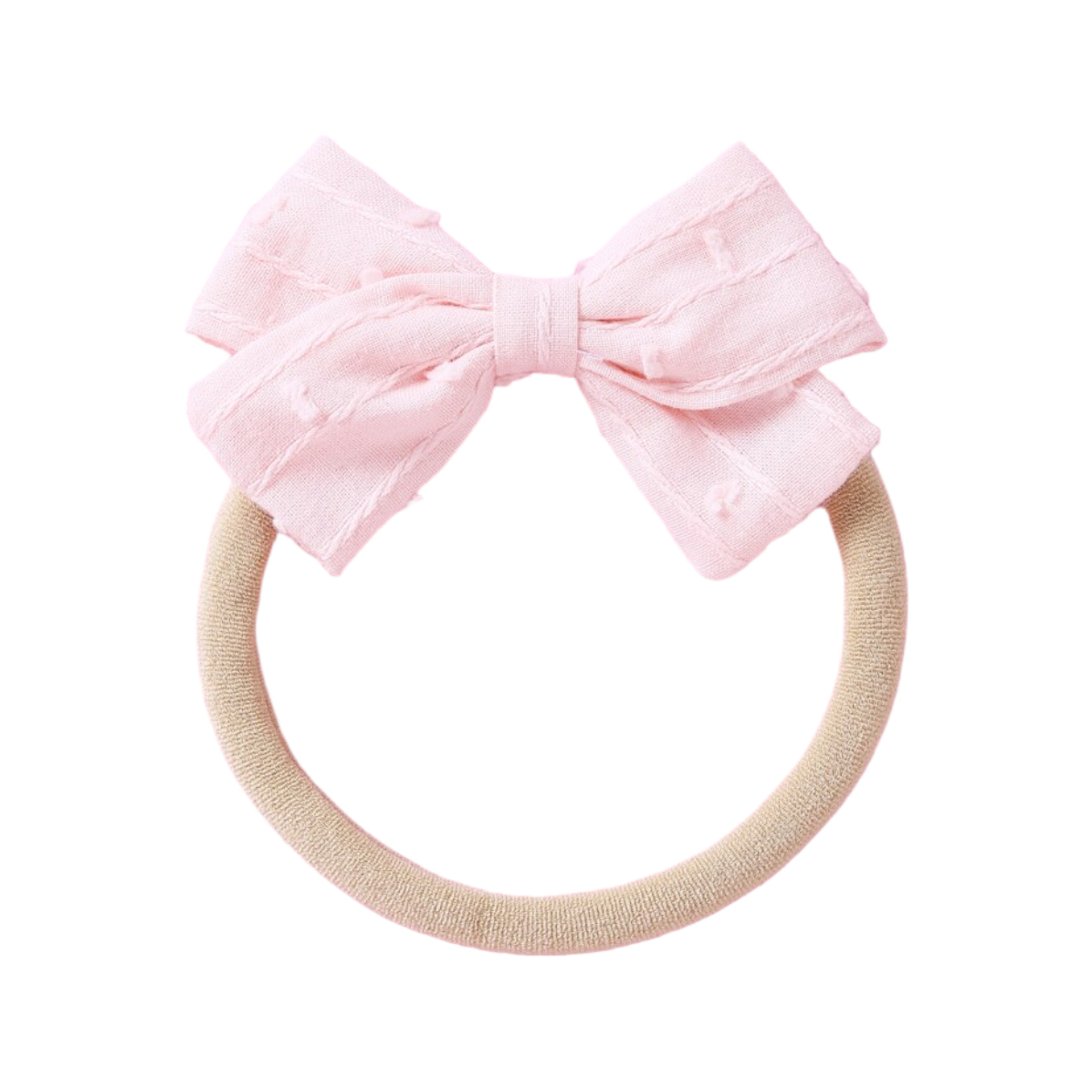 Dotty Embroidered Cotton Baby Bow in Rouge — baby accessory styled flat lay with nursery accessories