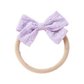 Lilac cotton embroidered baby accessory — Dotty Embroidered Cotton Baby Bow on white background