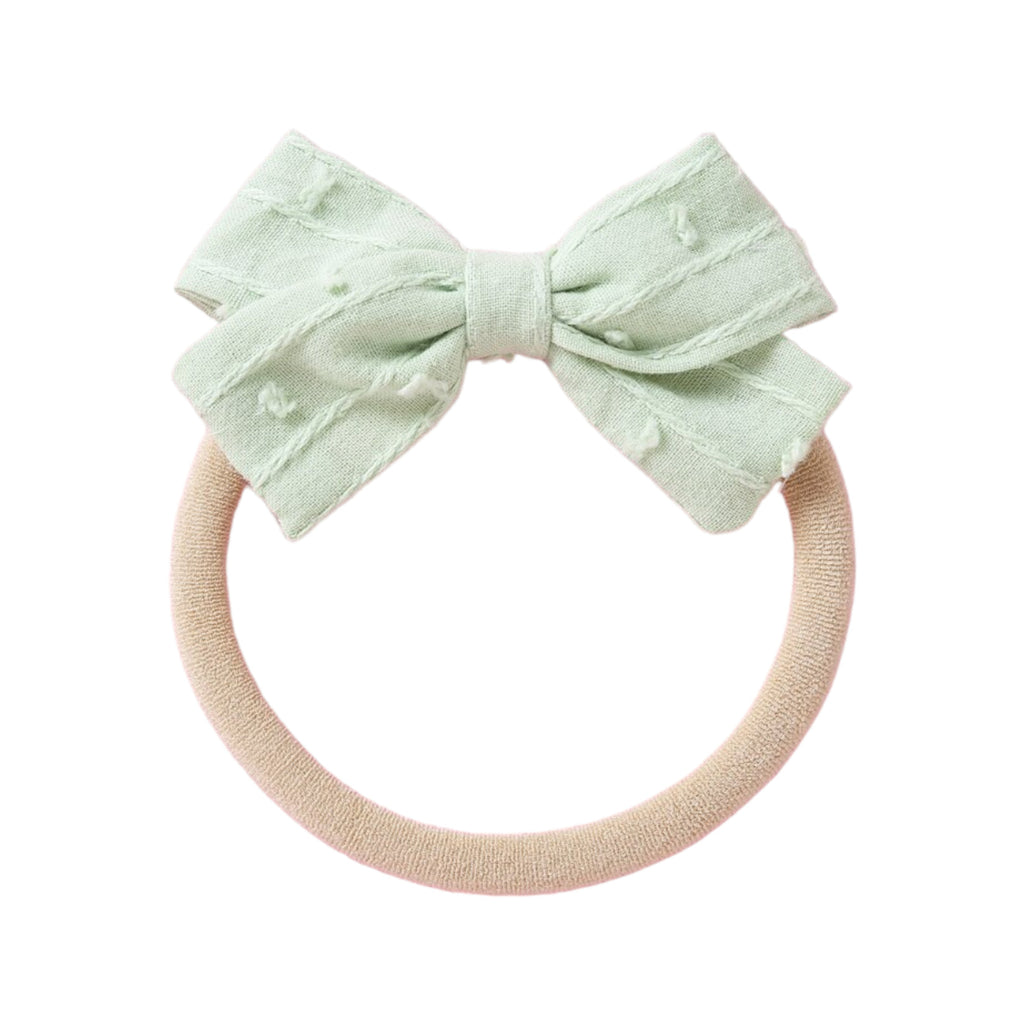 Mint cotton embroidered baby accessory — Dotty Embroidered Cotton Baby Bow on white background