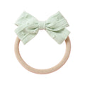 Mint cotton embroidered baby accessory — Dotty Embroidered Cotton Baby Bow on white background