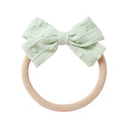 Dotty Embroidered Cotton Baby Bow in Peach — baby accessory size and scale reference