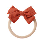 Rouge cotton embroidered baby accessory — Dotty Embroidered Cotton Baby Bow on white background