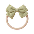 Sage cotton embroidered baby accessory — Dotty Embroidered Cotton Baby Bow on white background