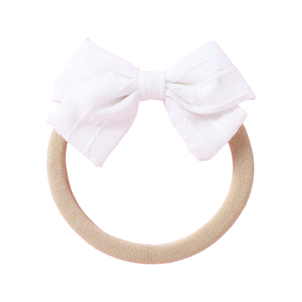 Dotty Embroidered Cotton Baby Bow in Peach — baby accessory size and scale reference