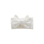 White knit oversized bow baby headband — Winnie Waffle Headband on white background