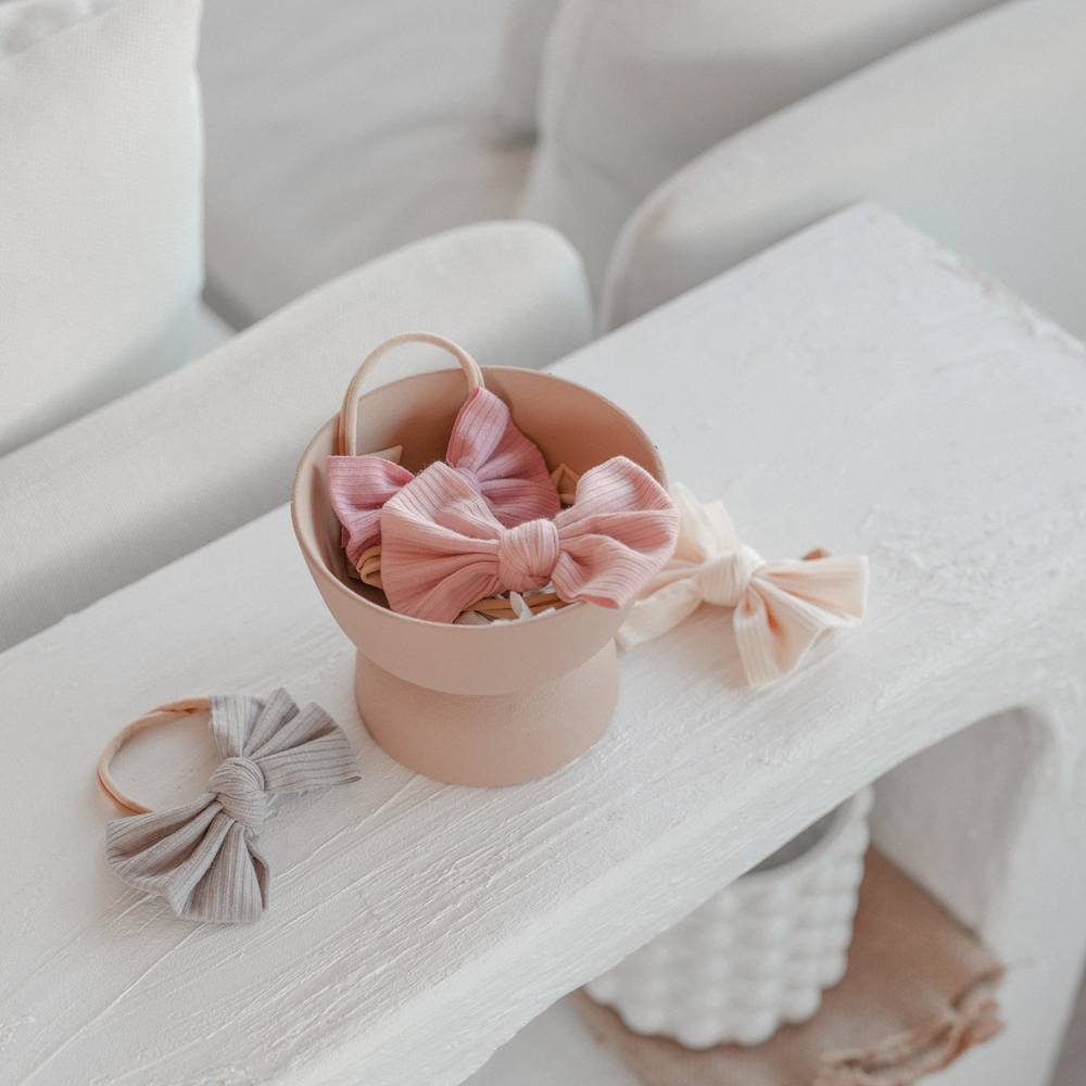 Baby Mini Textured Bow Headband in Blush — close-up of textured on blush baby headband