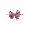 Blush nylon textured baby headband with bow detail — Baby Mini Textured Bow Headband on white background