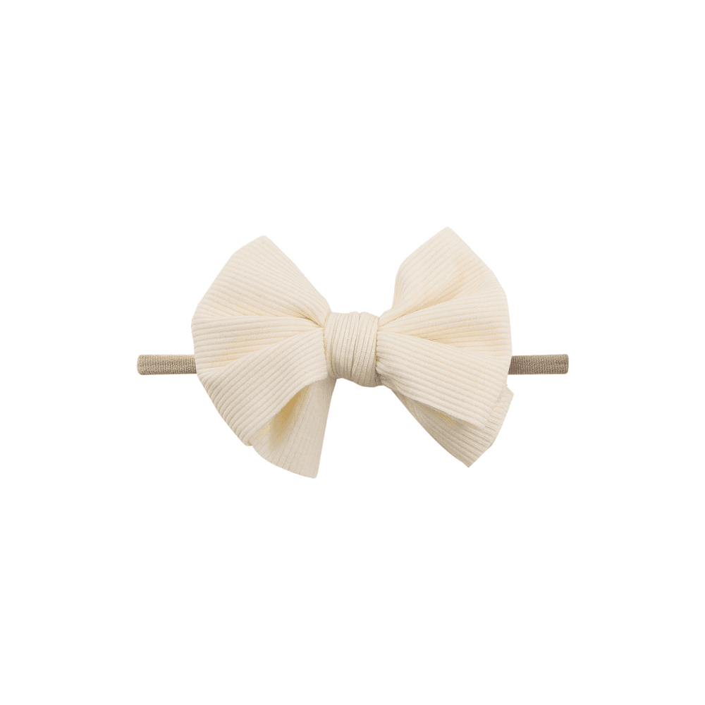 White nylon textured baby headband with bow detail — Baby Mini Textured Bow Headband on white background
