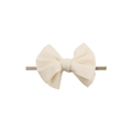 White nylon textured baby headband with bow detail — Baby Mini Textured Bow Headband on white background
