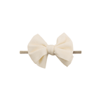 White nylon textured baby headband with bow detail — Baby Mini Textured Bow Headband on white background