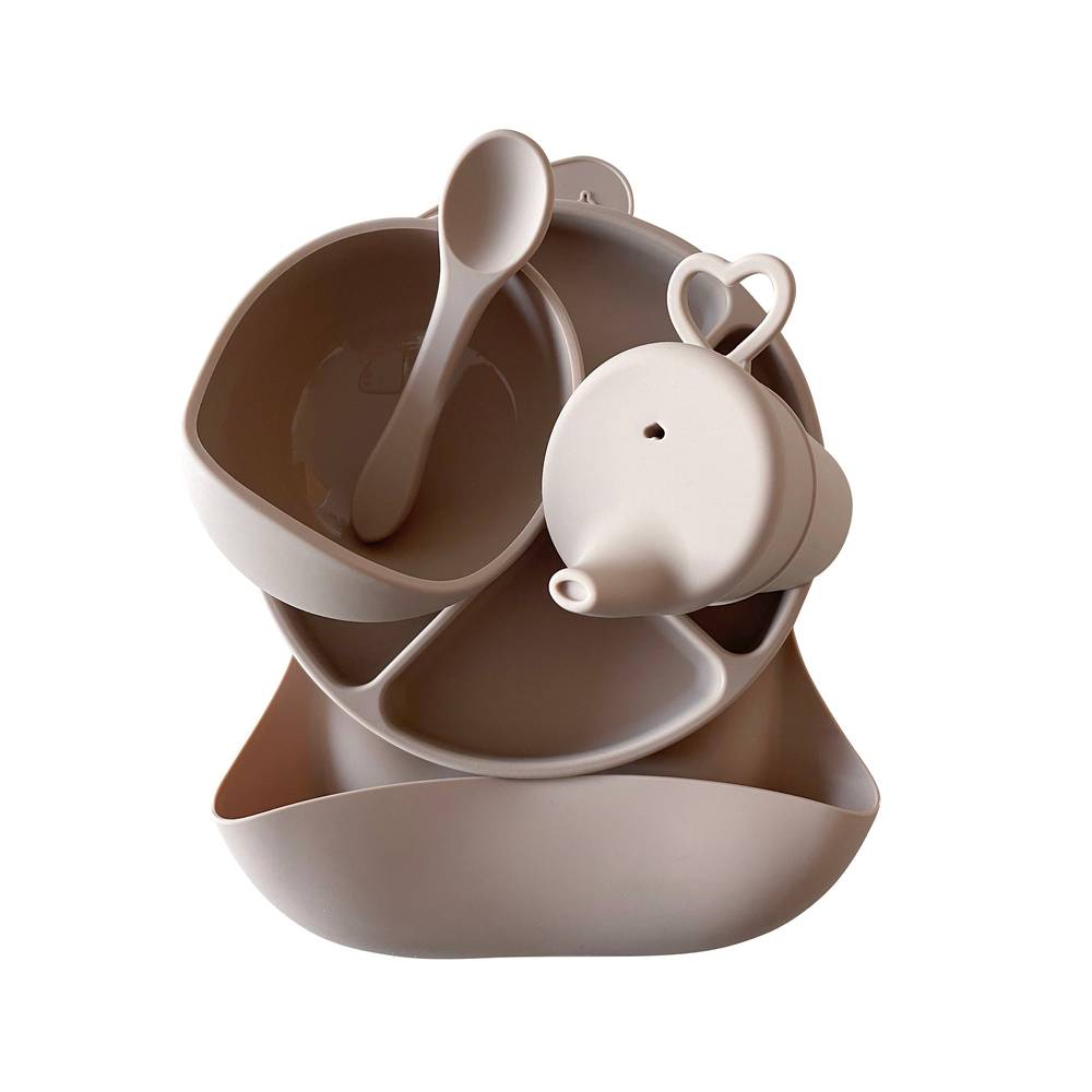 Silicone Baby Feeding Set in Almond Frost — cat baby bib showing face and soft texture