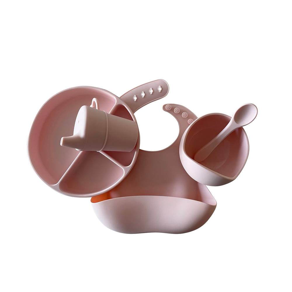 Baby wearing cherry blossom baby bib during mealtime — Silicone Baby Feeding Set