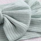 Baby girl wearing power blue baby headband with ear detail — Bambi Soft Bow Headband