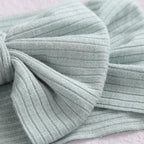 Bambi Soft Bow Headband in Glisten Red — close-up showing nylon texture and craftsmanship