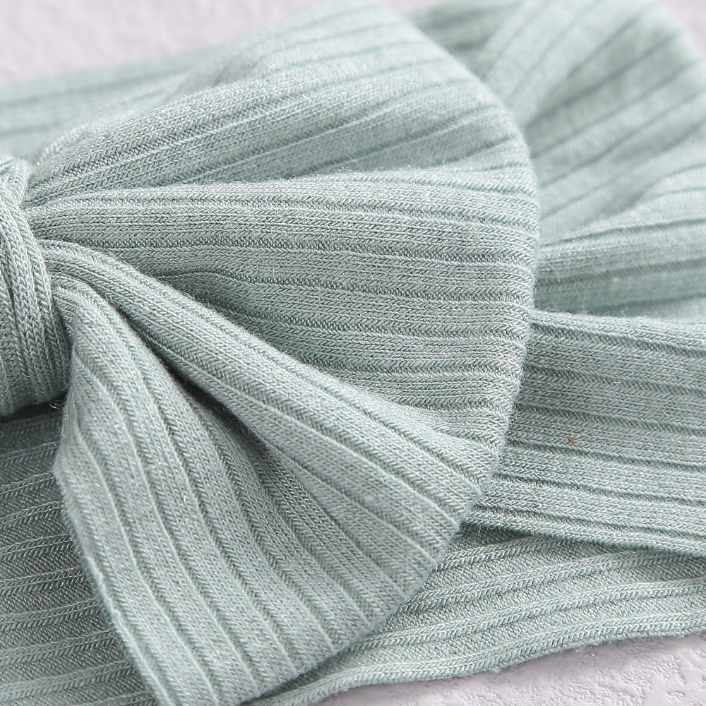 Bambi Soft Bow Headband in Glisten Red — close-up showing nylon texture and craftsmanship