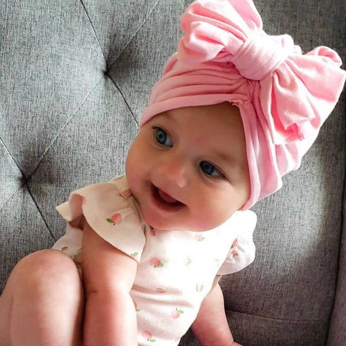 Baby Top Knot Bow Turban Pink — baby turban close-up showing bow
