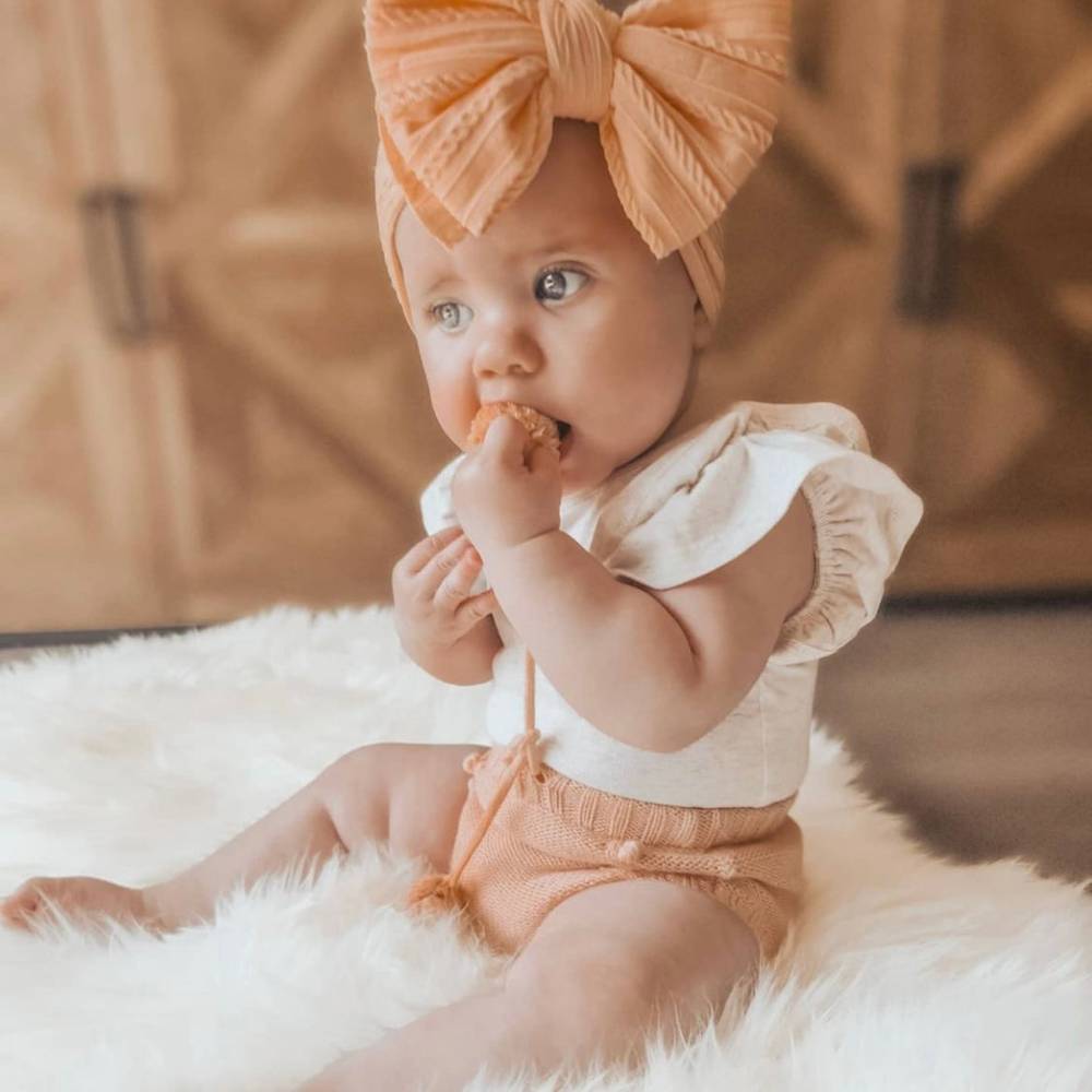 Bowie Double Bow Headband in Peach Orange — peach orange baby headband product styling