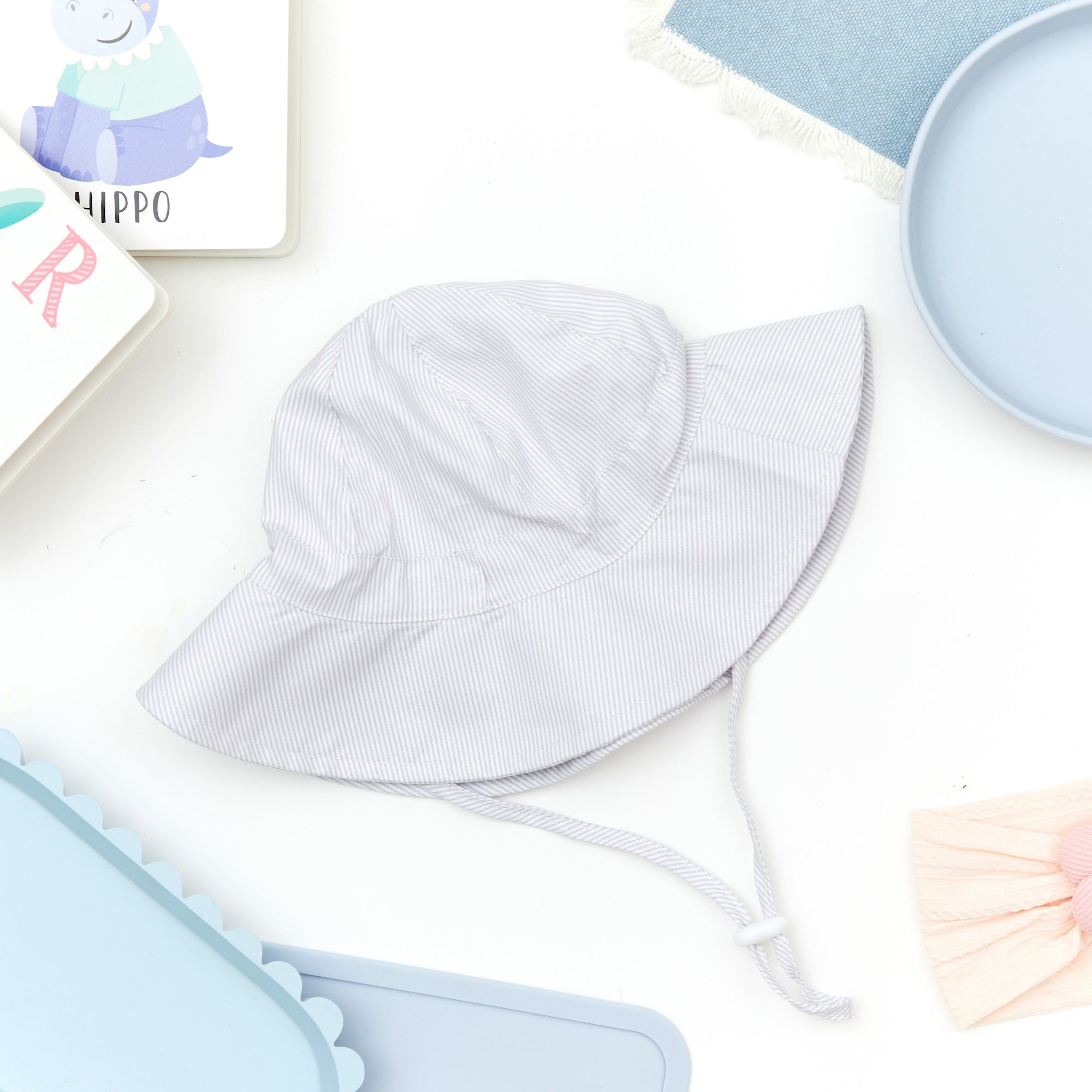 Baby wearing bright white baby hat — Wide Brim Baby Sun Hat