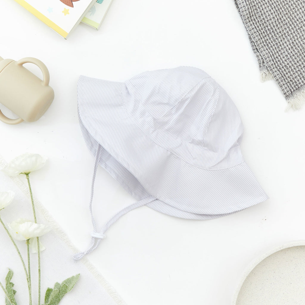 Wide Brim Baby Sun Hat in Bright White — cat baby hat showing face and soft texture