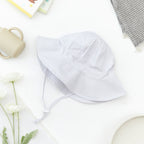 Wide Brim Baby Sun Hat in Bright White — cat baby hat showing face and soft texture