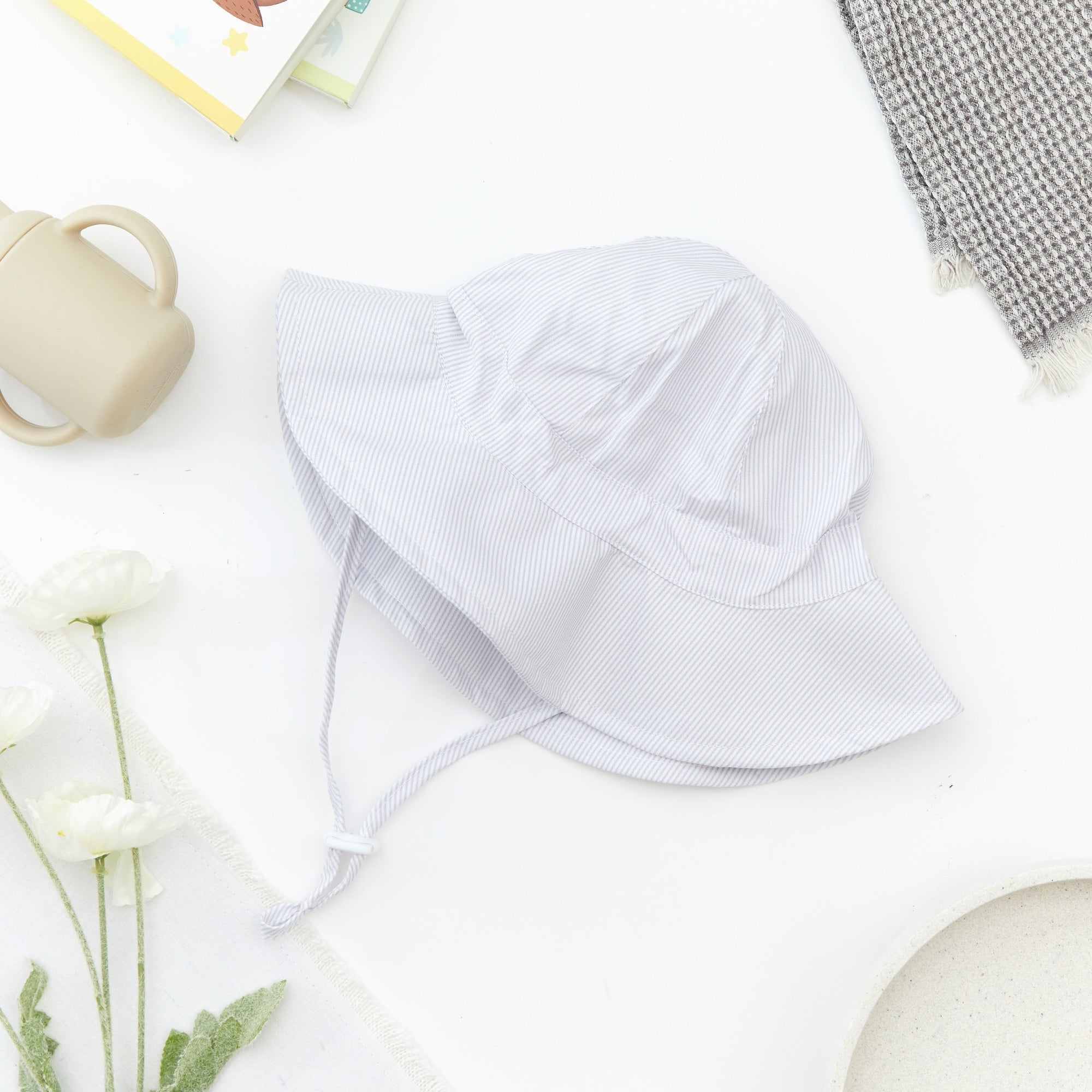 Wide Brim Baby Sun Hat in Bright White — cat baby hat showing face and soft texture