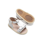 Baby feet in baby sandals on soft surface — Coconut White Leather Baby Bow Sandal