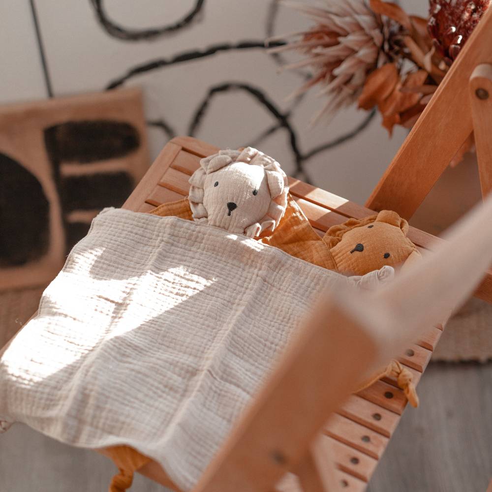Cotton Baby Comforter Leo The Lion in Ivory — close-up showing cotton muslin texture and craftsmanship