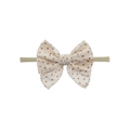 Cream speckle nylon oversized bow baby headband — Frankie Bow Headband on white background