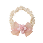 Cushion Daisy Crochet Baby Headband in Fairy Floss — cat baby headband showing face and soft texture
