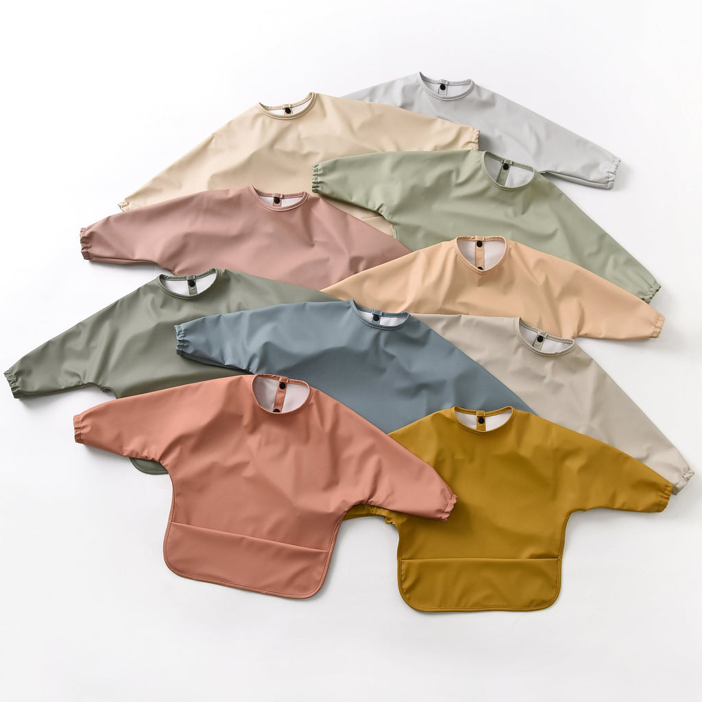 Baby wearing baby bib during mealtime — Green Smoke Waterproof Baby Smock Bib Long Sleeve