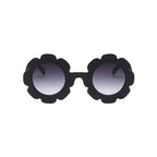 Edna Round Flower in Jet Frame Dark Lens Sunglasses — cat baby sunglasses showing face and soft texture