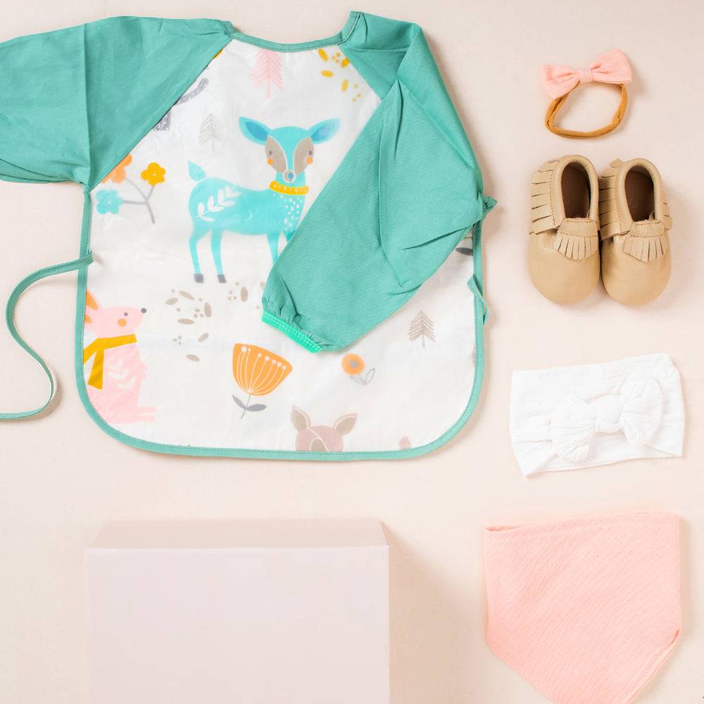 Baby girl gift bundle linen baby gift set — "Isn't She Lovely" New Bub Essentials on white background