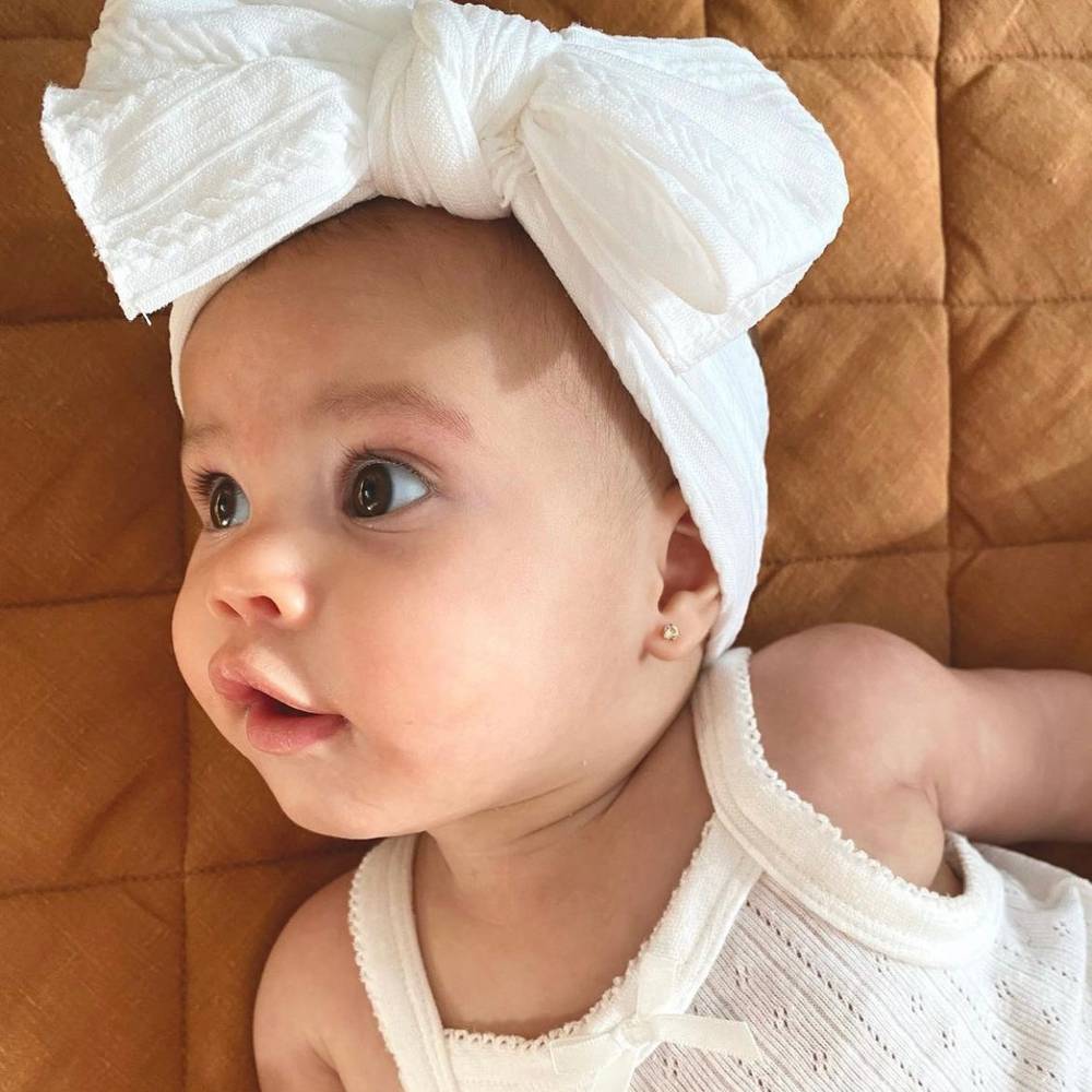 Bowie Double Bow Baby Headband in White — baby headband size and scale reference
