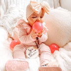 Wisp Pink Leather Baby T Bar Shoe — baby shoes styled flat lay with nursery accessories