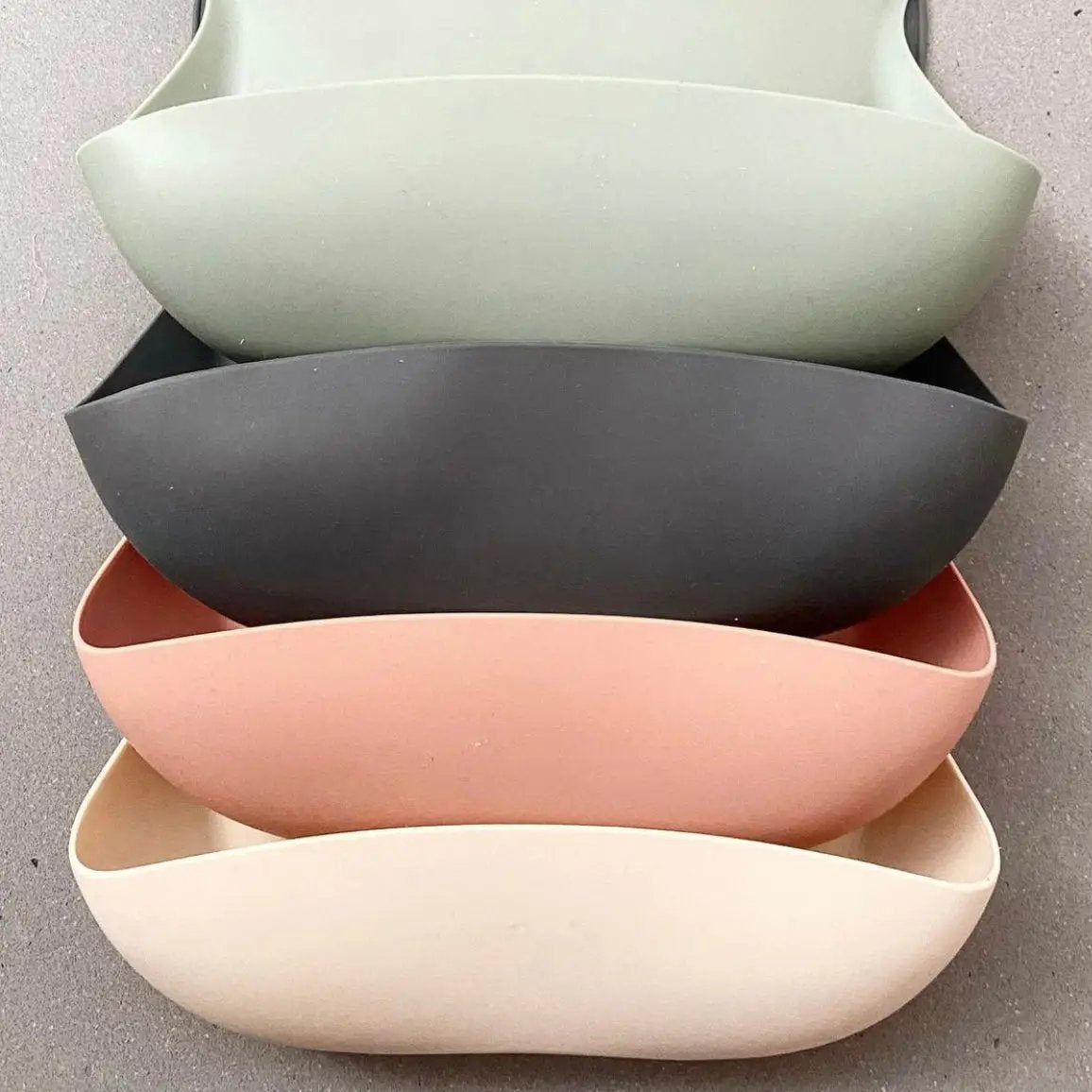Silicone Waterproof Baby Bib in Chalet Green — cat baby bib showing face and soft texture