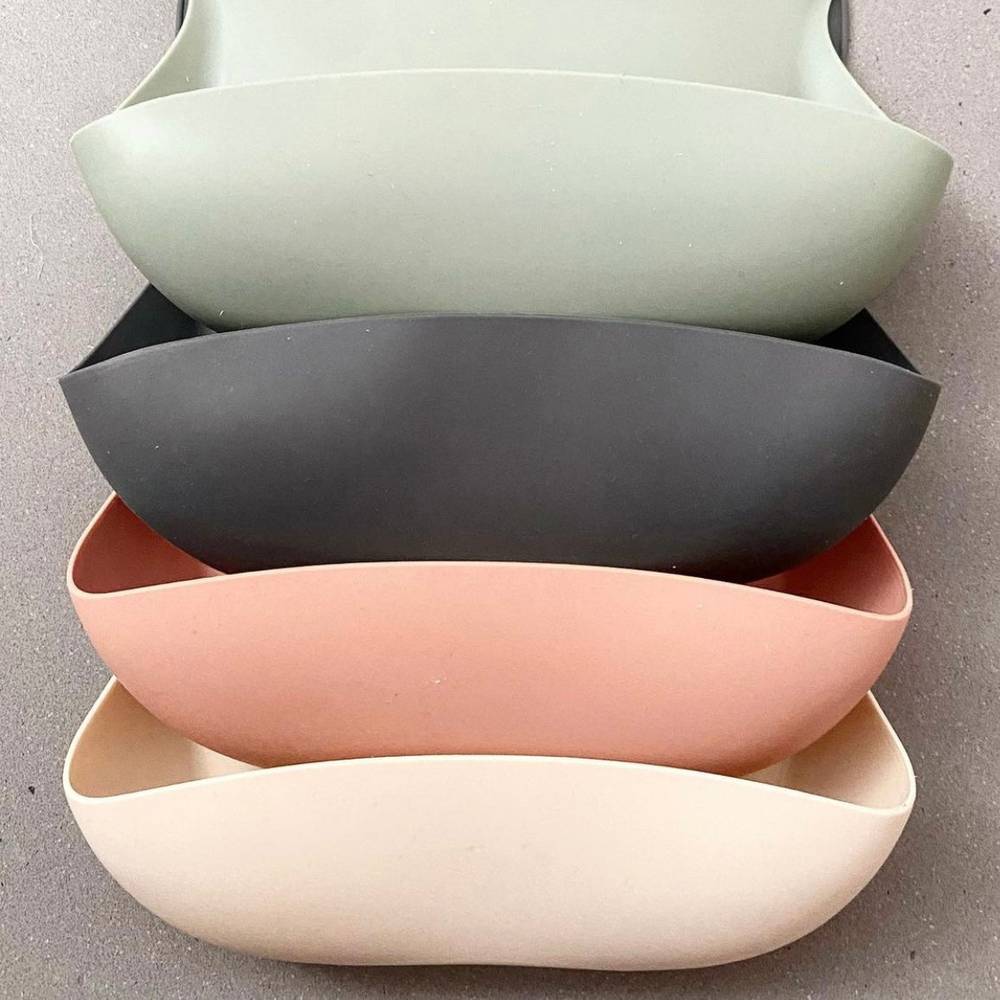 Silicone Waterproof Baby Bib in Buttermilk — cat baby bib showing face and soft texture