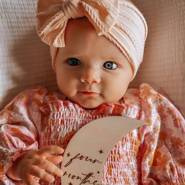 Bowie Double Bow Headband in Coral — coral baby headband product styling