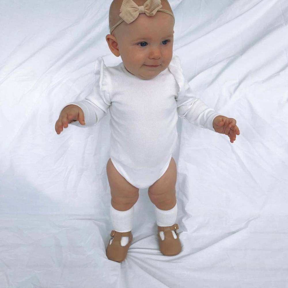 Peanut Leather Baby T Bar Shoe — baby shoes styled flat lay with nursery accessories