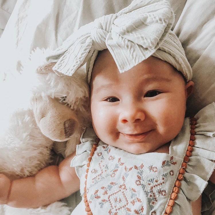 Bowie Double Bow Headband in Ivory — baby headband size and scale reference