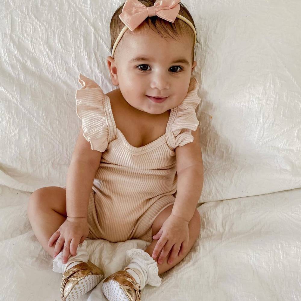 Tinka Tiny Bow in Peach — cat baby hat showing face and soft texture