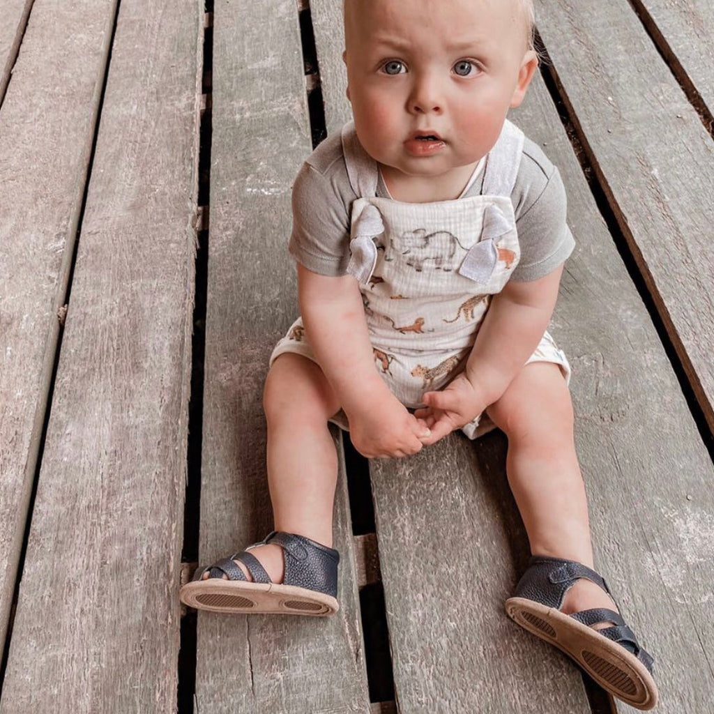 Zodiac Blue Leather Baby Sandal — baby sandals styled flat lay with nursery accessories