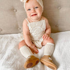 Peanut Leather Baby T Bar Shoe — baby shoes styled flat lay with nursery accessories