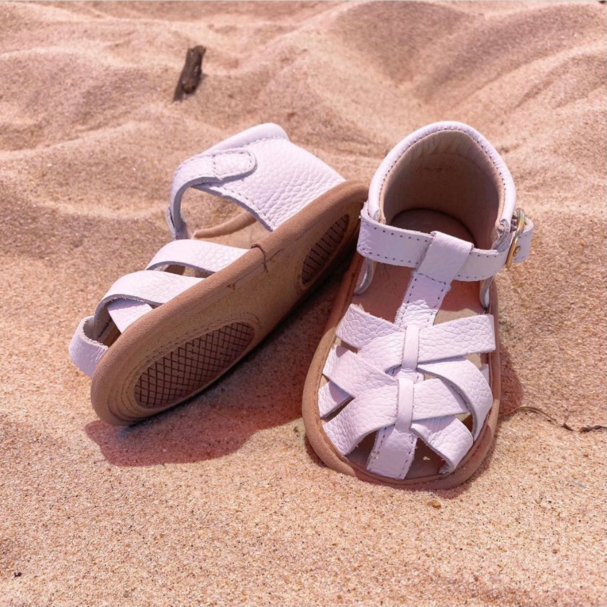 White Leather Baby Sandal — baby sandals styled flat lay with nursery accessories